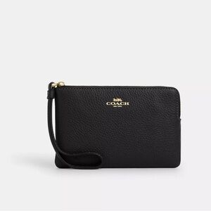 Brand new coach corner zip wristlet.
